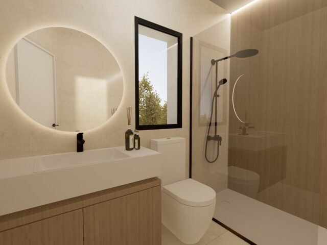 Modern bathroom with walk-in shower and backlit round mirror, Golf Houses new build townhouse